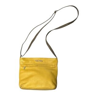 Nicoli yellow pebbled leather crossbody purse. Adjustable strap.